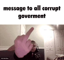 a person giving the middle finger with the words message to all corrupt government below