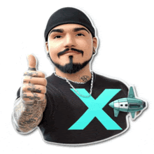 a man giving a thumbs up while wearing a black shirt with a large x on it