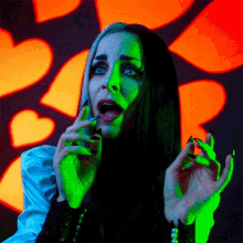 Bite Finger Lily Munster GIF - Bite Finger Lily Munster Sheri Moon Zombie GIFs