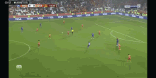 a soccer game is being played in a stadium with visa ads on the sidelines