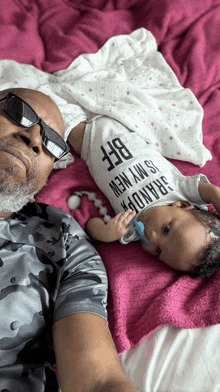a baby wearing a bff is my new grandpa shirt