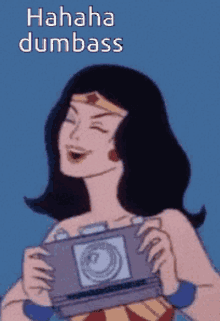 wonder woman is holding a camera and laughing with the words " hahaha dumbass " below her