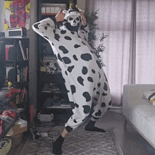 a person in a dalmatian costume with a skull mask on their face