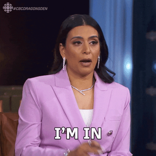 a woman in a purple suit is saying 