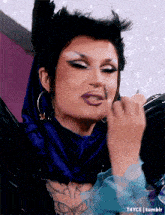 a close up of a drag queen applying makeup with a t4yce tumblr watermark in the corner