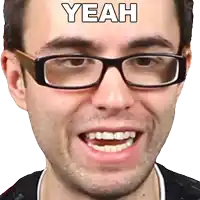 a man wearing glasses is smiling with the word yeah above him