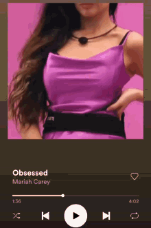 a woman in a purple dress is playing obsessed