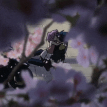 a couple sitting on a motorcycle with purple flowers behind them