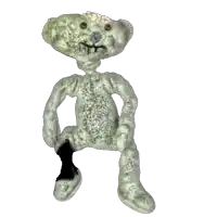 a white teddy bear with a black leg and a blue nose