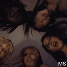 a group of women are laying in a circle and the letters ms are above them