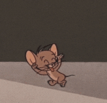 a cartoon of jerry from tom and jerry is standing on a concrete surface .