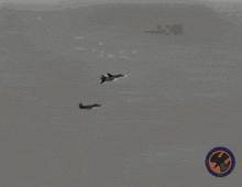 2 F 14 Tomcat Jets Launching Countermeasures And Turning F14 Tomcat Dropping Flares GIF