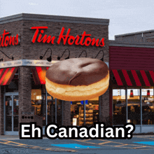 a donut in front of a tim hortons restaurant