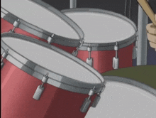 a person is playing the drums with a drumstick