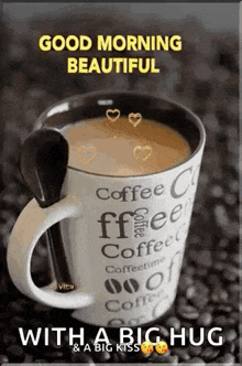 a cup of coffee with a spoon in it and the words `` good morning beautiful '' .