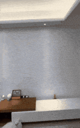 a living room with a white ceiling and a white wall