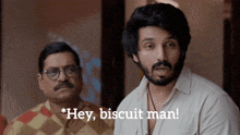 a man with a beard says hey biscuit man in front of another man
