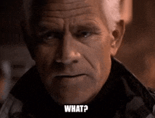 a close up of an older man 's face with the words `` what ? '' written on it .
