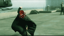 a man with a red octopus on his head in a video game scene