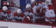a hockey game is being played between the carolina crows and the detroit red wings