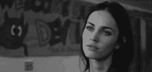 a black and white photo of a woman with the words to quase morrendo in white letters