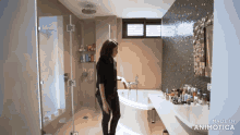 a woman in a bathroom with the words made in animotica on the bottom right