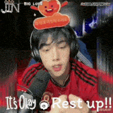 a young man wearing headphones and a red shirt says it 's okay to rest up !