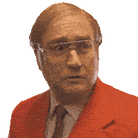 a man wearing glasses and a red suit is looking at the camera