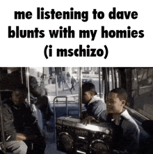 a group of people are sitting in a bus listening to a boombox .