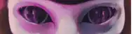a close up of a cat 's eyes with purple and pink highlights .