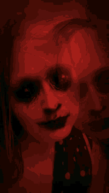 a black and white photo of a woman with a scary face