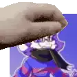 a hand is holding a piece of paper in front of a cartoon character with a scarf around his neck .