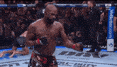 a fighter in a ufc ring with a banner that says better.com