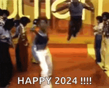 a group of people are dancing in a room with the words `` happy 2024 '' written in the background .