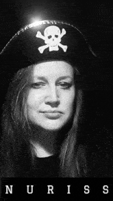 a woman wearing a pirate hat with a skull on it