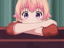 a girl with pink hair and purple eyes is leaning her head on a table