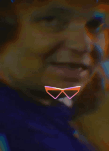 a close up of a man 's face with a pair of sunglasses on his face