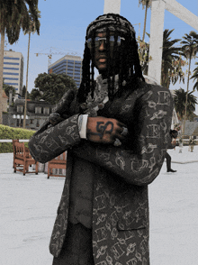 a man with dreadlocks is wearing a black jacket with the letter g on it