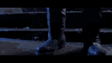a person standing in front of a door with a light on