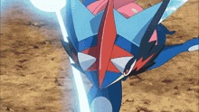 a blue and red pokemon is holding a light beam