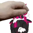 a pixel art of a hand holding a stuffed animal with pink ears .
