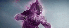 a close up of a purple monster with a purple light coming out of its mouth .