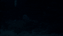 a dark blue background with a few dots on it