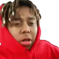 a man with dreadlocks is wearing a red hoodie and making a funny face .