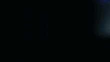 a silhouette of a person standing in the dark