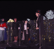 a blurry picture of people standing in front of a sign that says ' x ' on it