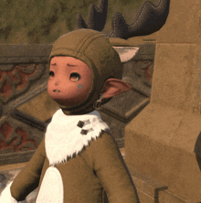 a child dressed in a reindeer costume with antlers on their head