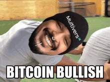 a man wearing a hat that says ' multivers ' on it is smiling