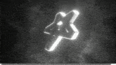 a black and white image of a glowing star with smoke coming out of it