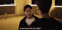 a man and a woman are talking to each other and the woman is saying `` so you have to be nice okay ? ''
